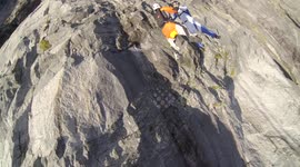 RAW VERSION: Sheer madness! Head-first base jump down cliff face