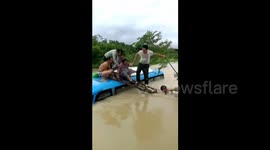 Police and villagers rescue 23 people on bus trapped in ditch