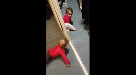 Baby twins discovering hide and seek