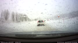Queue during blizzard on snowy Swedish road