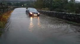 Car gets stuck in floodwaters near Hawes in North Yorkshire