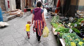 Mama and Toddler Walk through Capo Market in Palermo (Sicily, Italy)