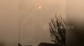 Bizarre 'red burning sun' glowing over Cardiff