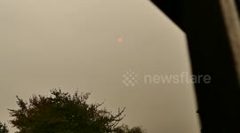 Sun red in the sky at mid day, nottingham, UK. Dust Storm? Hurricane Ophelia?