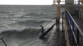 FURTHER FOOTAGE: This diehard is out for a 5km swim during Storm Ophelia
