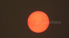 Stunning close-up of 'red sun' phenomenon over the West Midlands