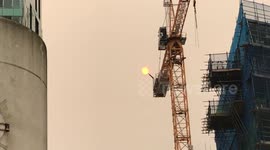 Red sun on top of crane over London is just amazing