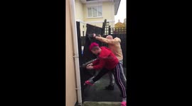 Homeowners desperately hold fence together during Storm Ophelia gales