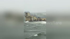 Man swimming in very rough sea during Hurricane Ophelia