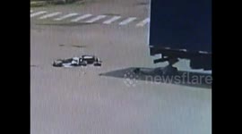Scooter driver survives being run over by lorry