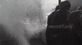 Cornish storm watchers drenched by monster wave