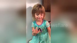 Three-year-old confuses peace sign with rude gesture