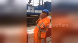 Construction workers pull colleague's tooth with string