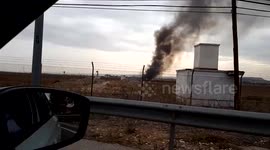 FURTHER FOOTAGE: Drive shot past smoking F18 jet ruins