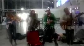 Welsh folk band entertain distressed passengers at Bristol Airport when flights were cancelled