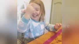 Pre-schooler pokes her face trying to 'touch her dreams'