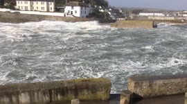 Nearly high tide at porthleven harbour during storm Ophelia