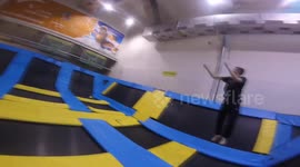 Two guys are shotting basketball basket three times in a row at ten metres