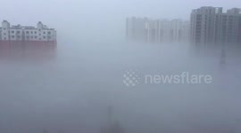 Skyscrapers in China swallowed by thick smog
