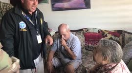 Soldiers sing with woman at Puerto Rican care home