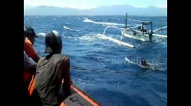 Save the fishermans whose boat is overturned in the sea