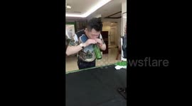 Kung fu master blows hole in bottom of glass bottle