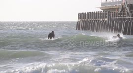 Surfers in Bournemouth beach as storm Brian reaches the South Coast of UK 20 October 2017. Video by John Beasley