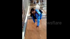 Tourist petrified by Yellow River's glass-bottomed bridge