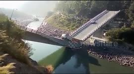 Miraculous escape after bridge collapses breaks in two