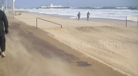 Wind and sand blowing through Bournemouth beach