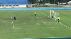 Thai goalkeeper celebrates penalty miss before ball bounces back into goal
