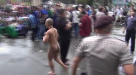 A naked man flashed through a student demonstration