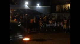 Jamaica. Ocho Ríos. People dancing Break Dance in the street with cars. 2014