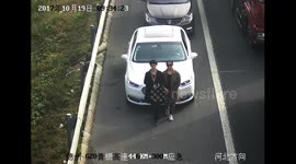 Women use bodies to cover car licence plates from CCTV