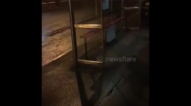 Irish guy jumps through bus shelter.