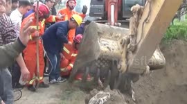 Firemen dig around well to rescue toddler trapped inside in China's Jiangsu