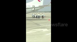 Flight attendant falls out of cabin pre-flight