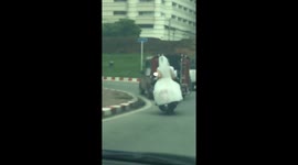 Bride riding pillion on motorcycle gets pulled over by police for not wearing helmet