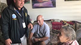 Soldiers sing with woman at Puerto Rican Elderly care home