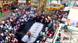 Woman rescued after tripping on hot coals during fire-walking ritual