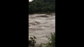 Flooded river smashes though 30-year-old bridge