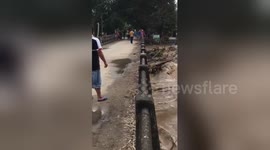 Flooded river smashes though 30-year-old bridge in Thailand