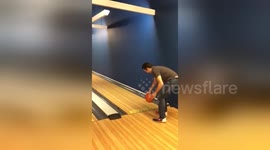 Man's fingers get stuck in bowling ball as he goes bowling for the first time
