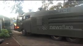 Armed police escort ballot papers to counting centre
