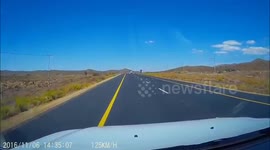 Trailer blown by wind smashes oncoming car windscreen