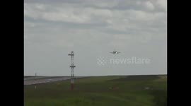 A jet aircraft aborts a landing in high winds at Leeds Bradford Airport