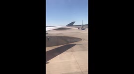 Plane taxiing from runway to terminal