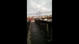 Skydiver narrowly misses streetlight while landing