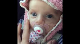 Heartwarming moment, baby gazes into her mums eyes.