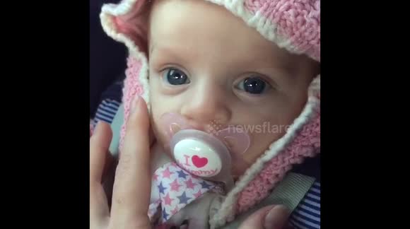 Heartwarming moment, baby gazes into her mums eyes.